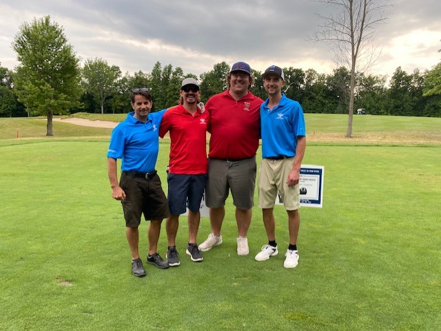 Four friends at the dreamcatchers golf tournament